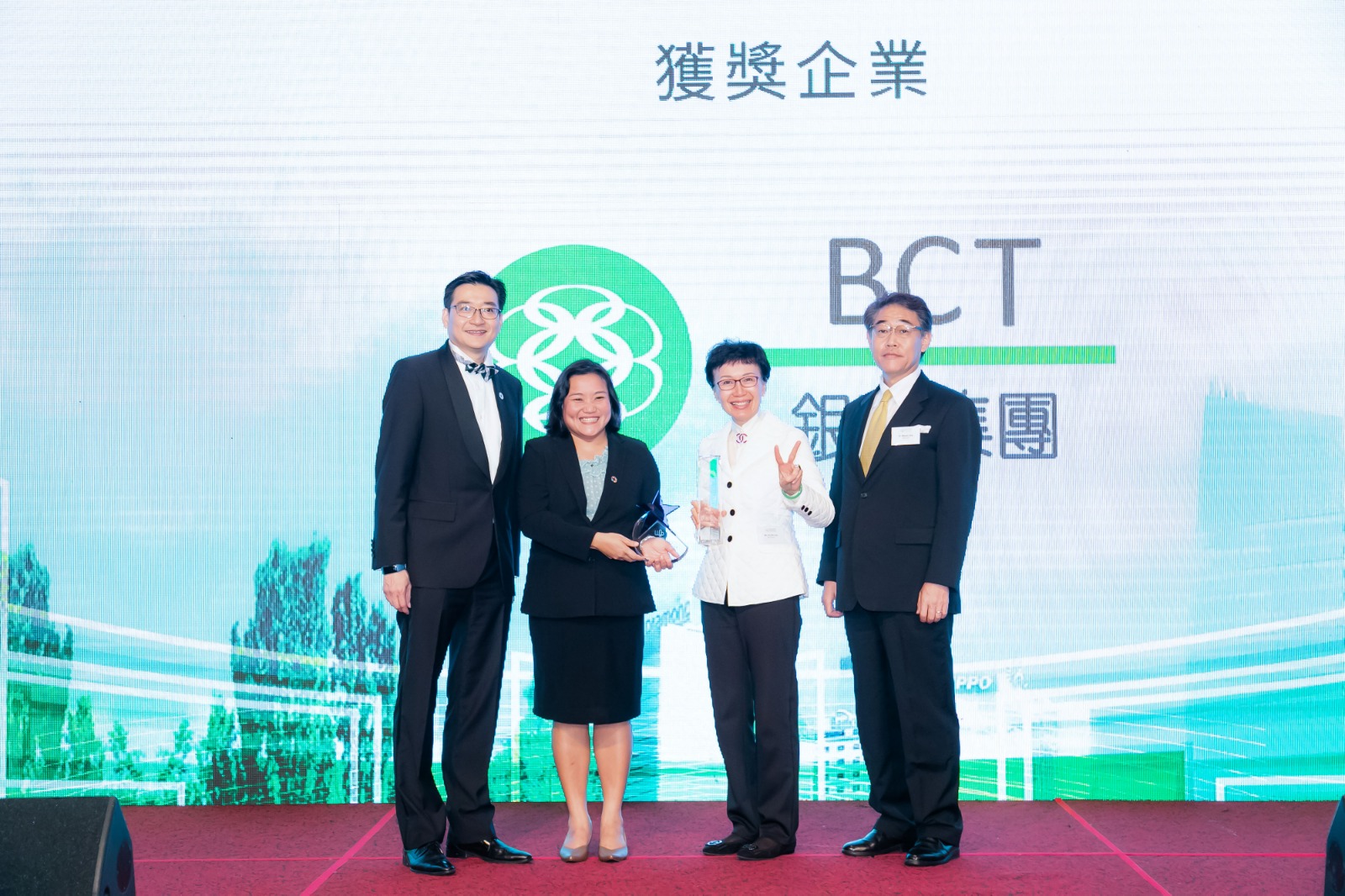 Ka Shi Lau, Managing Director & CEO of BCT (second from the right), received two awards from Tientip Subhanij, Chief of Financing for Development Section, MPFD, ESCAP (second from the left)